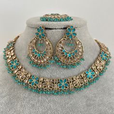 Auqa Antique Polki Kundan necklace set/Reverse Ad Necklace/Statement necklace/Indian/Punjabi Necklace/Pakistani Jewelry/Bridal necklace/ Antique Reverse Ad Stone Necklace With Mehndi Plating Regular Size And Adjustable Necklace Width 0.75 Inches Earrings Length 2.25 inches and Width 1.5 inches Tikka length 5.5 inches and Width 1.5 inches Ships from California in 1 day and delivery in 2-5 business day in the USA   This is 100% Handmade jewelry. So Color, shades, texture displayed may slightly var Round Meenakari Necklaces For Eid, Round Bollywood Necklace For Eid, Meenakari Necklaces For Eid, Bollywood Style Round Necklace For Eid, Bollywood Chandbali Necklaces For Eid, Bollywood Style Chandbali Necklaces For Eid, Festive Bohemian Kundan Jewelry Sets, Bohemian Kundan Jewelry For Eid, Pakistani Jewelry Bridal