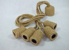 three ropes tied to each other on a white surface