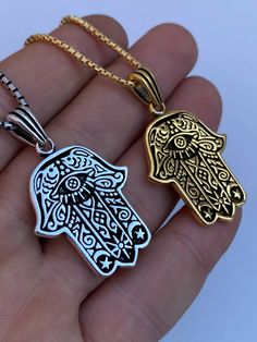 "Beautifully Hand crafted Hamsa pendants **IF YOU WANT A PENDANT ONLY AND NO CHAIN, PLEASE SELECT \"0\" CHAIN LENGTH** Solid 925 sterling silver! Unique custom made one of a kind! We have 2 styles! Rhodium finished & 14k yellow gold finished! Gold is vermeil bonded to solid silver underneath so color wont fade or tarnish Both are oxidized (blackened to give a more vintage look) Pendant measures roughly 1.25\" by 1.25\" (1.75\" w. bale)...weighs roughly 10.5 grams! 100% 925 silver...not plate Metal Necklace With Polished Finish For Gift, Handmade 14k Gold Jewelry For Good Luck, Symbolic Stainless Steel Pendant Jewelry, Polished Metal Necklace For Gift, Symbolic White Gold Stainless Steel Jewelry, Amulet Style Jewelry With Polished Finish As Gift, Gift Amulet Jewelry With Polished Finish, Good Luck Sterling Silver Tarnish-resistant Jewelry, Symbolic Stainless Steel Jewelry With Polished Finish