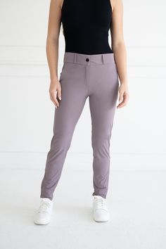 The Peggy Pant is Abendroth Golf’s signature product. It was designed by our founder and PGA Professional, Emily, to meet the need for the perfect women's golf pant. The Peggy Pant features a tapered leg and ankle zip, and includes five-pockets. Each pocket is big enough to store your phone, scorecard, keys, and any other essentials. One pocket has a zipper closure to keep valuables safe and secure. The Peggy Pant's feminine style combines function and professionalism, making it a versatile pant for on and off the course! Nylon/Spandex Blend Four-way stretch, sweat-wicking performance material High waisted, relaxed fit straight through the hip and thigh Tapered leg, fitted at the ankle with zip closure Machine wash cold, tumble dry or hang dry Golf Pants, S Signature, Perfect Woman, Perfectly Imperfect, Ladies Golf, Feminine Style, Tapered Legs, Pants For Women, Relaxed Fit