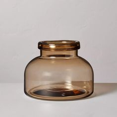 a clear glass jar with a gold lid