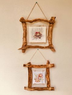 two wooden frames hanging on the wall