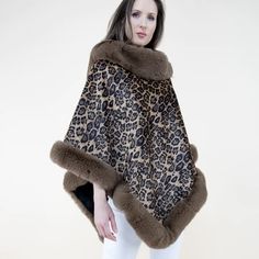 Introducing our stunning LEOPARD Animal Print Velvet Faux Fur Poncho - the perfect addition to your wardrobe! This beautiful poncho will not only keep you warm, but also add a touch of style to any outfit. Featuring a wide fur trim, this poncho is exceptionally soft and will keep your neck and front nice and warm. The open front style makes it easy to wear and perfect for layering over your favorite outfits. Whether you're heading out for a casual day or attending a special occasion, our poncho is versatile and will elevate your look. Made with high quality materials, the voluminous natural-like fur gives off a luxurious feel, making it the perfect layering piece for all your fashion outings and cold seasons. It's also ideal for various occasions such as casual outings, holidays, festivals Velvet Poncho, Sequin Scarf, Turtleneck Poncho, Poncho Wrap, Ladies Poncho, Leopard Animal, Fur Trim, Ponchos, Free Size