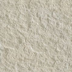 a close up view of a white textured wall