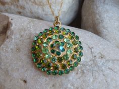 Green Necklace, Round Green Pendant, Green Jewelry, Green Crystal Rounded Pendant Necklace, Halo Gold Green Necklace This stunning halo green round pendant necklace have a great statement look that can't be missed. It would be great women necklace for evening dress or daily. Metal: 24K Gold Plated Gemstone: crystals Size: 3 cm long (1.18 inches). Chain: 45 cm long (about 18 inches) FOR MY NECKLACES COLLECTION HERE: https://www.etsy.com/il-en/shop/rebekajewelry?section_id=14211169&ref=shopsec Green Round Large Pendant Jewelry, Green Necklace With Large Medallion Pendant, Green Round Pendant Necklace For May Birthstone, Green May Birthstone Round Pendant Necklace, Gold Green Necklace, Small Heart Necklace, Climbing Earrings, Ear Crawler Earrings, Ear Parts