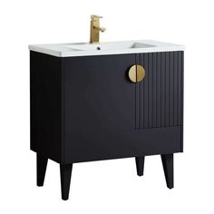 a black and white sink cabinet with gold knobs on the door, in front of a white background