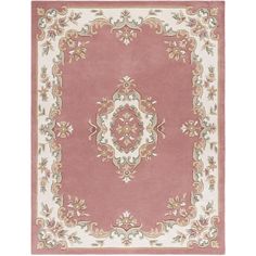 a pink rug with an ornate design on the bottom and sides, in various colors