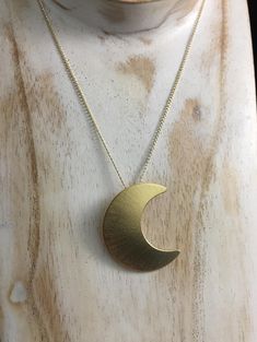 "Featuring the likeness of Stevie Nicks' own sterling silver 1 1/4\" crescent moon (20 gauge in thickness). Comes with a gold-gilled curb chain with the pendant facing left, towards the heart, just like Stevie wears. :) There is a 24K gold-plating overlay on the sterling silver moon pendant for a real gold finish without the expense of solid gold. The curb chain is gold-filled, which has more gold content than a plated chain. I draw the moon layout on sterling sheet, then pierce and cut the shap Gold Moon-shaped Engraved Jewelry, Gold Engraved Moon-shaped Jewelry, Gold Moon-shaped Engraved Necklace, Yellow Gold Moon-shaped Brass Jewelry, Moon-shaped Yellow Gold Brass Jewelry, Yellow Gold Brass Jewelry With Moon Phase, Gold Crescent Brass Jewelry, Yellow Gold Moon Phase Jewelry In Brass, Engraved Moon-shaped Brass Necklace