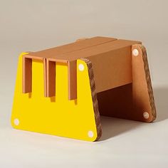 a small wooden step stool made out of cardboard