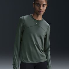 Whether it's a chill in the air or powerful rays, this easy-fitting crew-neck is ready to support you on your run. Sweat-wicking tech helps keep you comfortable and dry, and UV protection adds extra coverage so you can feel confident as you log your daily miles. Nike Activewear For Training, Nike Technical Go-dry Tops, Nike Technical Breathable Tops, Nike Technical Running Tops, Nike Breathable Crew Neck Activewear, Nike Technical Crew Neck Activewear, Nike Technical Activewear With Crew Neck, Nike Functional Crew Neck Activewear, Nike Functional Crew Neck Top