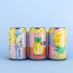 three cans of pineapple beer on a blue background