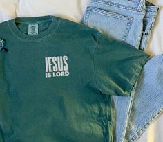 These soft unisex Comfort Colors shirts are embroidered with JESUS IS LORD. Let us know if you'd like us to use white or black thread when you check out :)  * 100% ring-spun cotton * Fabric weight: 6.1 oz/yd² (206.8 g/m²) * Garment-dyed * Relaxed fit * 7/8″ double-needle topstitched collar * Twill-taped neck and shoulders for extra durability * Double-needle armhole, sleeve, and bottom hems SIZING:  They're unisex but fit true to size (or very close to) for ladies. We recommend sizing up though if you prefer a roomier or oversized look! Guys, we definitely suggest sizing up. As these shirts are personalized we do not offer exchanges or refunds unless an error has been made so please check measurement chart before ordering. We would love to assist if you need help! CARE: Wash inside out in Church Tshirt Designs, Christian T Shirt, Church Tshirts, Faith Tees, Jesus Is Lord, Camping Shirt