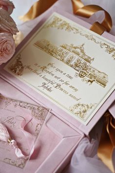 pink and gold wedding stationery with roses