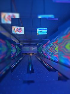 an abstract image of bowling lanes with neon lights