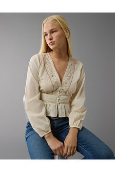 V-neckline with embroidery/Long sleeves/Peplum hem Casual V-neck Blouse With Embroidered Sleeves, Fall V-neck Blouse With Embroidered Sleeves, Casual V-neck Top With Embroidered Sleeves, Casual Embroidered V-neck Top For Fall, Feminine Embroidered V-neck Blouse, Elegant Embroidered Cotton V-neck Top, Embroidered V-neck Blouse For Fall, Chic Cotton Embroidered V-neck Top, Chic V-neck Embroidered Cotton Top