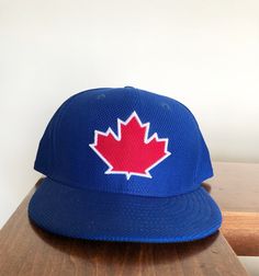 New Era Fifty Nine Fifty Toronto Blue Jays Fitted Hat size 7 1/2. This is a great looking hat that is different from the normal New Era's. It is unique, great color and awesome design. Sports Event Fitted Hat With Flat Brim, Blue Flat Brim Baseball Cap One Size Fits Most, Blue Flat Cap For Baseball Season, Blue Baseball Cap With Flat Brim, Blue Flat Brim Baseball Cap For Baseball Season, Blue Flat Bill Snapback Hat For Baseball Season, Blue Flat Brim Snapback Hat For Baseball Season, Blue Flat Bill Trucker Hat For Baseball Season, Blue Fitted Hat For Sports Events