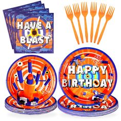 a birthday party set with orange and blue plates, forks, napkins and decorations