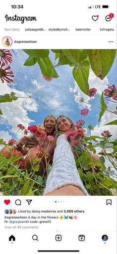 the instagram page on instagram shows two women sitting in flowers and one is taking a selfie