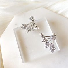 Our Fate and Chance Earrings are princess-worthy, bride-worthy quality earrings that feature sweeping line of geometric shapes in an ear jacket style. Using the highest grade AAA cubic zirconia, these gems will sparkle like no other! Ear Jacket Style: wear the stud alone for a simple, every day look OR together with the back part for a glamorous look Stud: 1/4 in Bottom /Back Piece: 1 inch wide Material: Copper, AAA cubic zirconia Lead, Nickel, Cadmium Free Earrings are FINAL SALE for hygienic r Elegant Cubic Zirconia Ear Climbers, Elegant Cubic Zirconia Ear Cuff With Matching Earrings, Elegant Silver Cubic Zirconia Ear Cuff, Elegant Silver Cubic Zirconia Ear Climbers, Elegant Wedding Ear Climbers With Diamond Accents, Elegant Cubic Zirconia Dangle Ear Cuff, Wedding Ear Climbers With Diamond Accents, Wedding Cubic Zirconia Drop Ear Climbers, Elegant Silver Ear Climbers With Diamond Accents