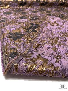 This is a beautiful floral reversible brocade using a combination of dusty purple and metallic threads as the jacquard is woven, creating a lovely, textural pattern. This brocade is a popular choice for gowns, statement jackets, stand-out skirts and more. The fabric does not require a lining. Content: Polyester/ Lurex Blend Color: Dusty Purple, Gold, And Black Width: 53 inches Gold And Purple Outfit, Dramatic Aesthetic, Purple Floral Fabric, Magic Fashion, Statement Jackets, Dream Library, Fashion Reference, Purple Line, Pinterest Ideas