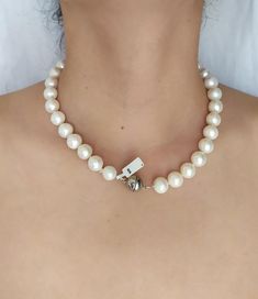 This timeless classic necklace is handmade with Freshwater Pearls knotted into a single strand.  Graduated beads measure 14.5 mm to 12.5 mm.  925 Sterling Silver round ball magnetic clasp.Necklace Length 45 cm (17.7 in)Handcrafted – one of a kind.  Made in Greece.All items are delivered ready for gift-giving. Please don’t hesitate to contact me if you have any questions regarding this item. I’ll be happy to assist you.Thank you for visiting my shop. View additional designs herehttps://www.etsy.c Beaded Necklace With Sterling Silver Clasp As Gift, Classic Pearl White Beaded Necklaces For Jewelry Making, Elegant Adjustable Necklace With 8mm Beads, Elegant Round Sterling Silver Beaded Necklaces, Classic Necklace With 8mm Beads For Gift, Classic 8mm Beaded Necklaces As Gift, Classic 8mm Beads Necklace For Gifts, Classic Adjustable Jewelry With 8mm Beads, Classic 8mm Bead Necklaces Perfect For Gifts