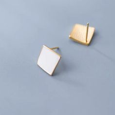 Make a statement with our sleek and stylish Geometric black white square stud earrings! Featuring a modern and eye-catching design, these earrings are the perfect addition to any outfit. The geometric shape adds a touch of uniqueness, while the black and white color combination effortlessly complements any style. Elevate your look and stand out from the crowd with these bold and elegant earrings. Materials: 925 sterling silverFinish: gold plate, enamelDimensions: 0.27 x 0.27 in Jewelry Care: See more information about how to care for your jewelry here. Shipping Policy: Orders will be shipped within 1-3 business days. Economy shipping will take 7-14 days to arrive and standard shipping is 1- 4 days for U.S. orders. International shipping time is depended on the country and per shipping meth Cute Stud Earrings, Silver Birthday, Square Stud Earrings, Silver Jewelry Earrings, Handmade Fashion Jewelry, Square Earrings Studs, Square Stud, White Square, Black And White Color