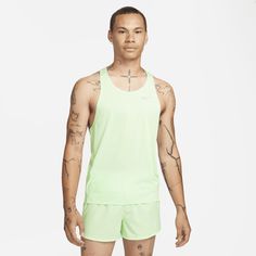 Designed for racing, the Nike Fast singlet offers lightweight breathability to help you move comfortably through every stride. Its relaxed fit and ultralight design won't get in your way from starting pistol to final kick. Running Singlet, Running Nike, Fastest Man, Running Vest, Dri Fit Shirt, Running Tops, T-shirts & Tank Tops, Sports Top, Man Running