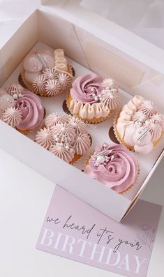 the cupcakes are decorated with pink frosting