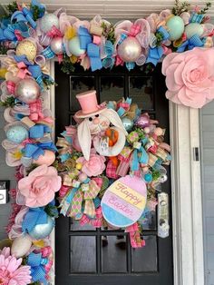 a door decorated with pink, blue and green decorations