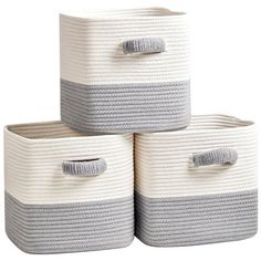 three white and grey baskets stacked on top of each other