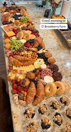 a long table filled with lots of different types of food on top of each other