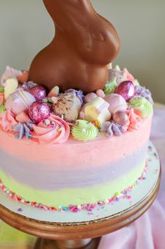 a cake decorated with chocolate bunny ears and candy candies