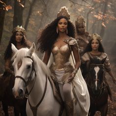 three women in costumes riding horses through the woods with trees and leaves behind them,