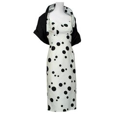 An ensemble so well-bred it practically demands lunch at the Plaza. Pair with a wide brimmed hat, sunglasses and a Yorkshire terrier (or Dalmatian puppy!) and prepare to stop traffic. Spaghetti strap wiggle dress with empire waist seam and full circumference princess seams for extreme curviness; low scooped back. Rear metal zipper closure with top hook and eye; lined to just above knee in white muslin. Matching polka dot wrap reverses to solid black. fabric: heavyweight polished cotton noteworth Wide Brimmed Hat, Runway Gowns, Tea Gown, 1950s Outfits, Dalmatian Puppy, Cocktail Dress Vintage, Brimmed Hat, Halter Midi Dress, The Plaza