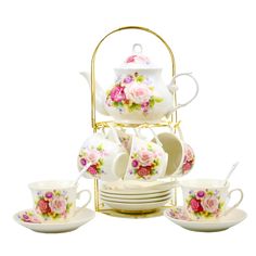 a white tea set with pink flowers on it