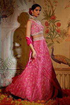 Rani pink lehenga with attached cancan and bandhani print. Paired with gota embroidered padded blouse and dupatta.
Component: 3
Pattern: Printed
Type Of Work: Bandhani
Neckline: V neck
Sleeve Type: Sleeveless
Fabric: Blouse and Lehenga - Crepe Silk, Dupatta - Net
Color: Pink
Other Details: 
Embroidered waistband
Scallop bordered dupatta
Occasion: Destination Wedding - Aza Fashions Bandhani Blouse, Tiered Lehenga, Bandhani Print, Rani Pink, Padded Blouse, Pink Lehenga, Luxury Sale, Silk Dupatta, Pink Blouse