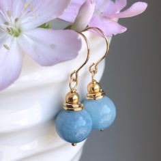 "6686 Aquamarine Earrings Gold Filled natural blue gemstone classic modern dangle drops simple everyday March birthstone birthday anniversary Valentine's day Mother's day Christmas holiday gift for her women mom sister wife girlfriend daughter niece aunt grandma cousin colleague best friend. Enjoy the beauty & power of natural gemstone. MATERIALS & DIMENSIONS ✦ Natural AQUAMARINE, sky blue, smooth round beads 10mm; ✦ GOLD FILLED beads, spacers, pins and fish hook (shown) or lever back ear wires; Blue Dangle Jewelry For Birthday, Classic Blue Earrings For Everyday, Elegant May Birthstone Blue Jewelry, Elegant Jewelry With Natural Stones For Birthdays, Elegant Natural Stone Jewelry For Birthdays, Elegant Natural Stone Jewelry For Birthday, Elegant Birthstone Earrings For Birthday, Elegant Sapphire Jewelry For Birthday, Fish Hooks Show