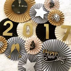 new year's decorations with gold and silver paper fans