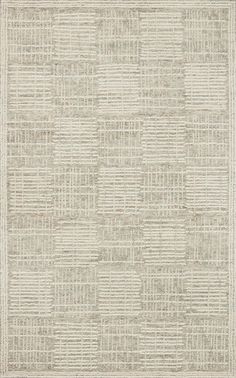 an area rug with squares and lines on the ground, in neutral colors that appear to be made out of fabric