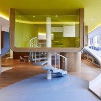 an indoor play area with slide and stairs