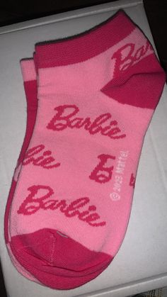 a pink sock with the word babe on it