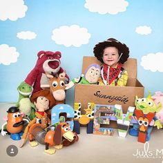 a young child is surrounded by toy characters