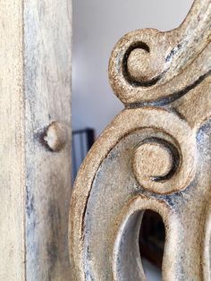 an ornate carved wooden door with metal knobs