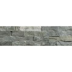 a stone wall that has been made out of various types of stones and is grey