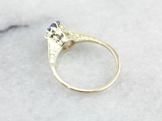 "This is a stunning early 1900's green gold engagement ring that has a rich luster! Utterly stunning, this vintage gold piece is lightly chased along the tall, polished shoulders. Green gold is created when gold is alloyed with sterling silver. The center stone of this incredible vintage setting is one of our loveliest sapphires! Blue as an October sky and filled with shine, this amazing stone is a perfect choice for this colorful setting! This ring would be amazing as an engagement ring, or sim Colorful Setting, Sapphire Solitaire Engagement Ring, Vintage Setting, October Sky, Sapphire Solitaire, Sapphire Engagement Ring, Oval Rings, Gold Piece, Gold Engagement Ring