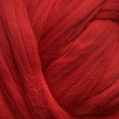 red wool is shown in this close up photo, it looks to be very soft