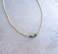 I want this: Emerald green gemstone necklace, gold chain simple necklace, dainty jewelry, May Birthstone Necklace Gold Emerald Birthstone Necklace In Minimalist Style, Dainty Gold Emerald Necklace With Delicate Chain, Delicate Gold Emerald Necklace As Gift, Gold Minimalist Emerald Birthstone Necklace, Delicate Gold Emerald Necklace Gift, Minimalist Gold Emerald Birthstone Necklace, Green Necklace With Gold Chain Gift, Green Necklaces With Gold Chain For Gifts, Delicate Green Charm Necklaces With Delicate Chain