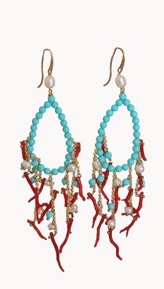 Large Chandelier Earrings made of; - Turquoise Paste stones (4 mm), light blue color; - Freshwater Pearls (4 mm), white color; - Red Coral branches; - Brass chains; - Gold plated 925 Sterling Silver hooks. Lenght : 10 cm / 3,94 inches * SHIPPING * Your order will be shipped within 1-3 business days from your purchase. You can choose between 2 shipping methods: STANDARD MAIL (NOT TRACEABLE) It is a cheap and fast shipping method, but NOT TRACEABLE. Chapeau Atelier is not responsible for any posta Elegant Turquoise Chandelier Earrings With Round Beads, Elegant Turquoise Chandelier Earrings, Light Blue Drop Earrings With Dangling Beads, Large Chandelier, Large Chandeliers, Baroque Fashion, Light Blue Color, Brass Chain, Earrings Photo