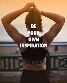 a woman standing in front of the ocean with her back to the camera and text reading be your own inspiration