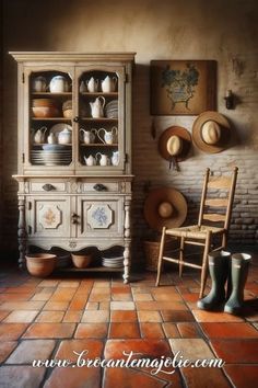 an old fashioned china cabinet in the corner of a room with red tile flooring